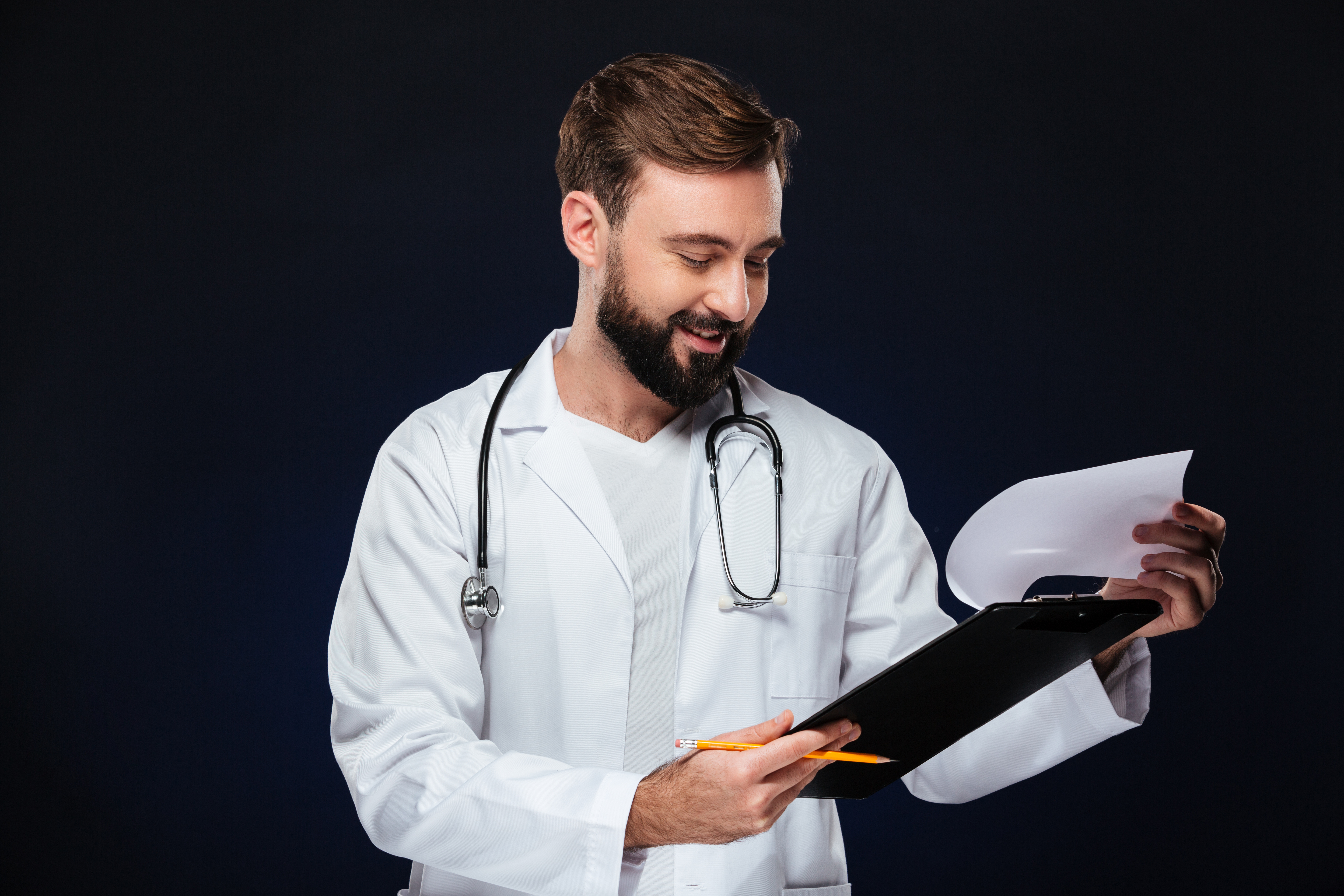 Doctor standing while wearing a lab kooot
